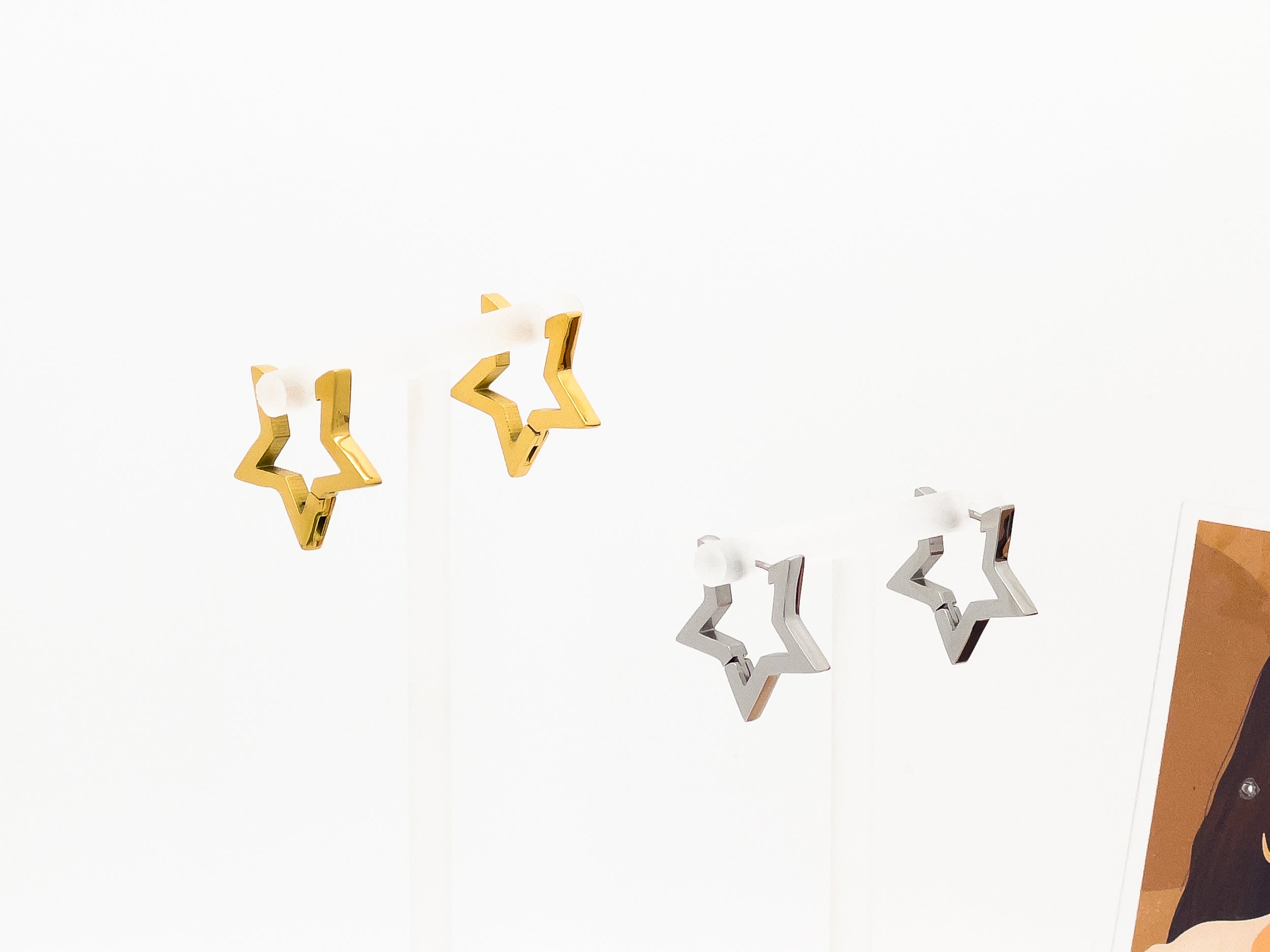 star earrings in gold and silver
