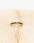 Black enamel surrounded gold ring